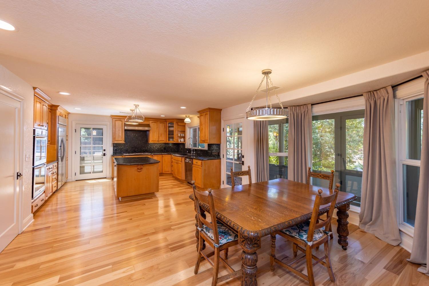 868 Fairview Road Ojai, CA 93023 - Photo 10 of 15 a dining room with furniture and wooden floor