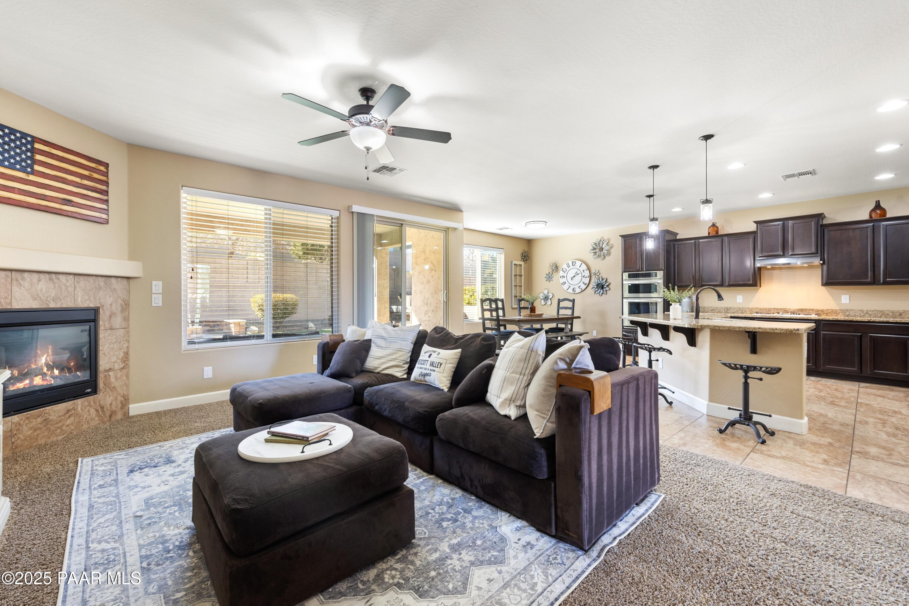 1200 Rusty Nail Road Prescott Valley, AZ 86314 - Photo 11 of 32 a living room with furniture and a fireplace
