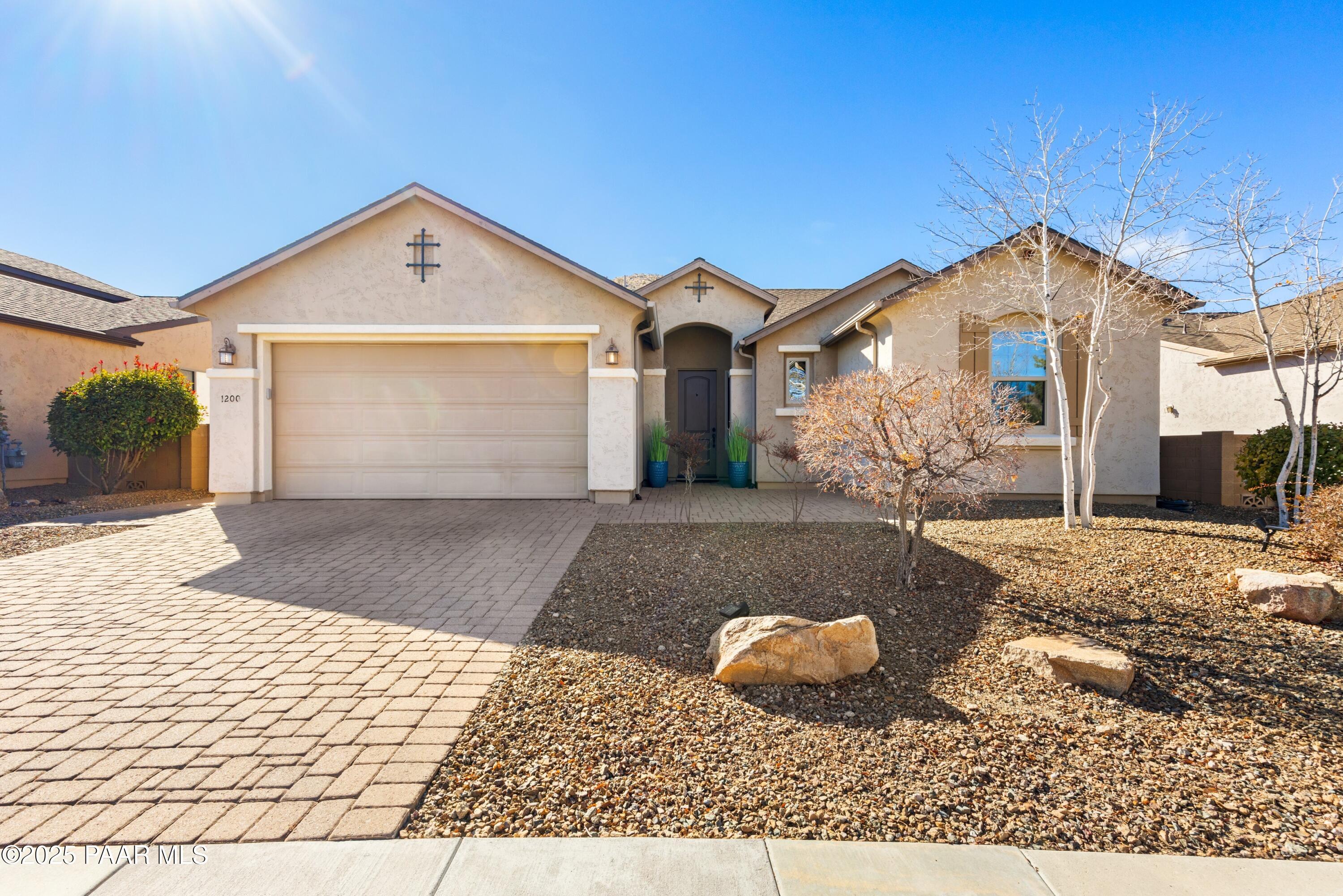 1200 Rusty Nail Road Prescott Valley, AZ 86314 - Photo 2 of 32 a front view of a house with a yard
