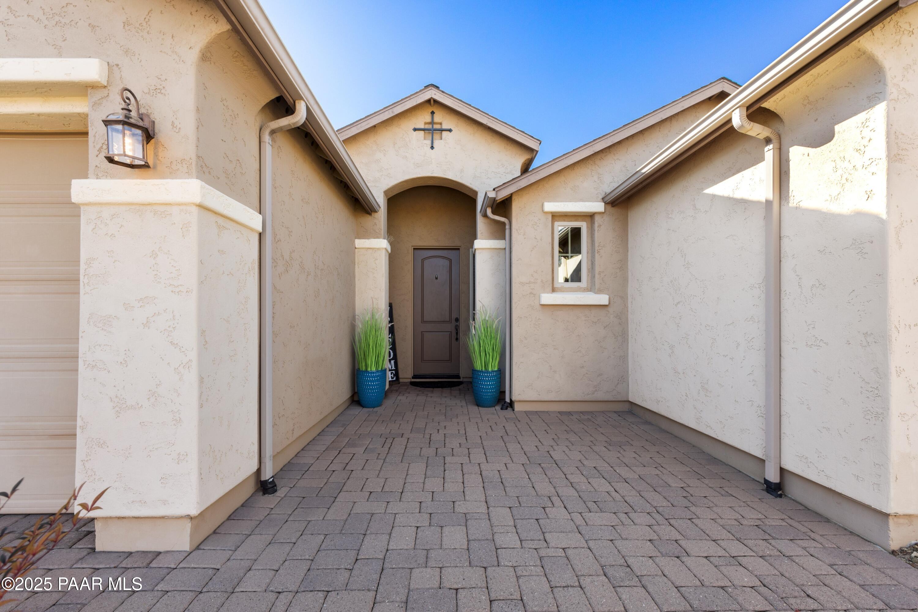 1200 Rusty Nail Road Prescott Valley, AZ 86314 - Photo 5 of 32 a view of a big house with wooden fence