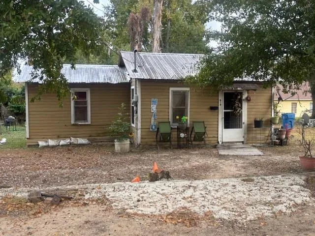 a front view of house with outdoor seating