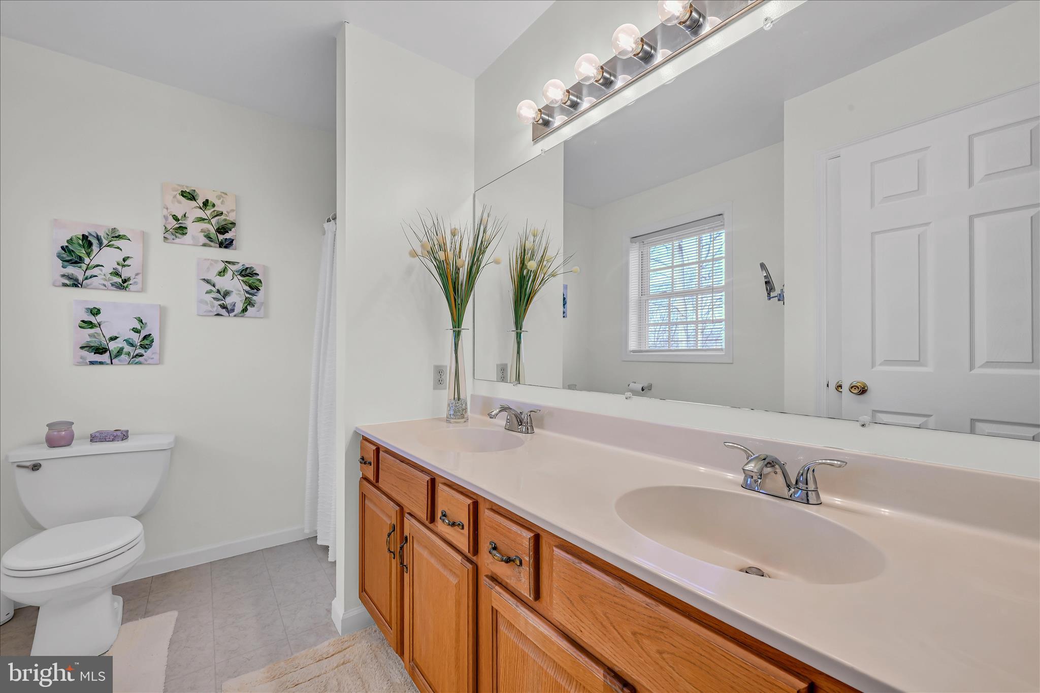 24 Heron Road Lititz, PA 17543 - Photo 20 of 37 a bathroom with a sink a toilet and a mirror