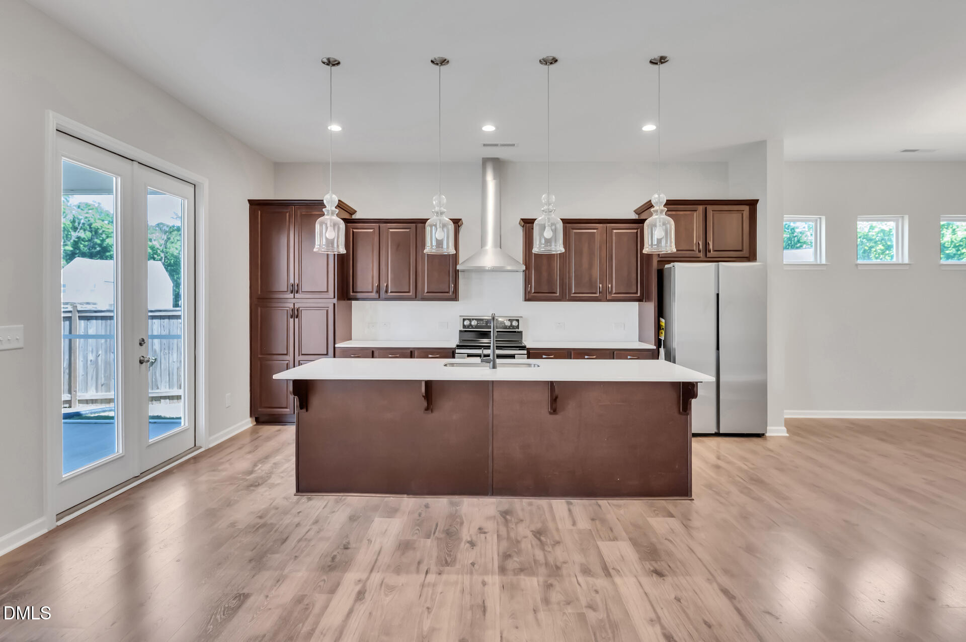 5406 Ripplebrook Drive Durham, NC 27712 - Photo 12 of 37 a view of kitchen with stainless steel appliances granite countertop a stove and a refrigerator