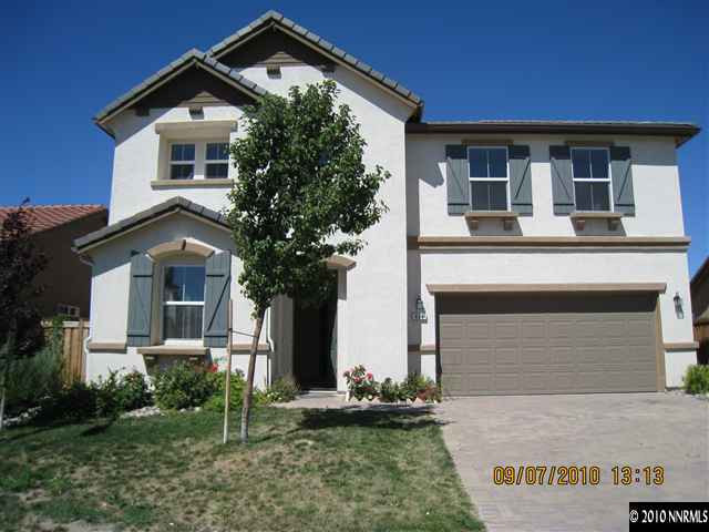 425 Cortono Drive Reno, NV 89521 - Photo 1 of 9 a front view of a house with garden