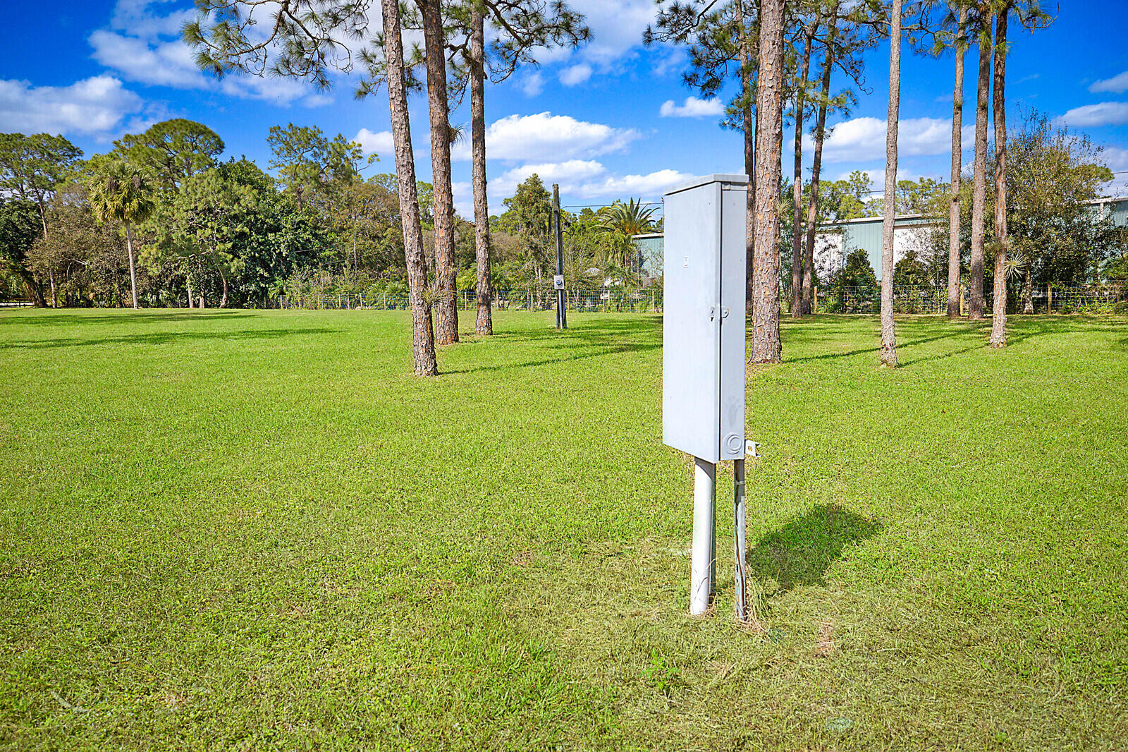 2140-2150 C Road Loxahatchee Groves, FL 33470 - Photo 5 of 12 a street sign on the side of the field
