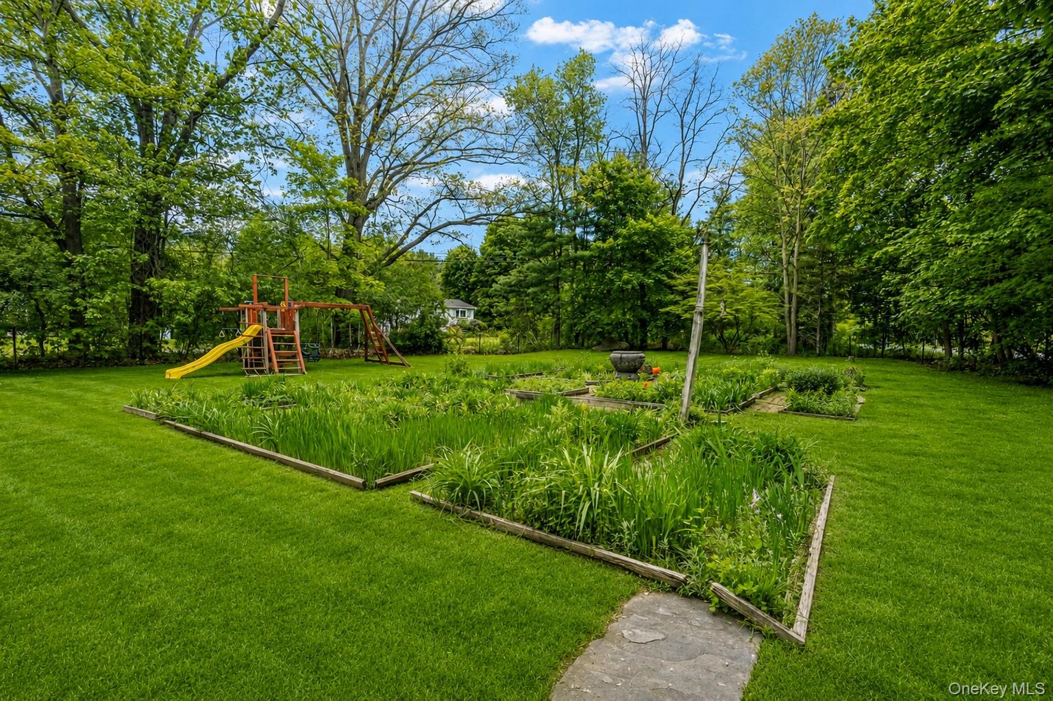 4 Clove Branch Road Hopewell Junction, NY 12533 - Photo 22 of 32 a view of an house with backyard