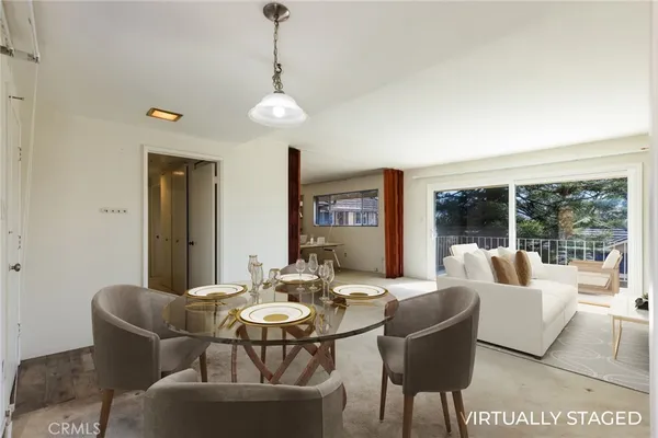 a living room with furniture and a table