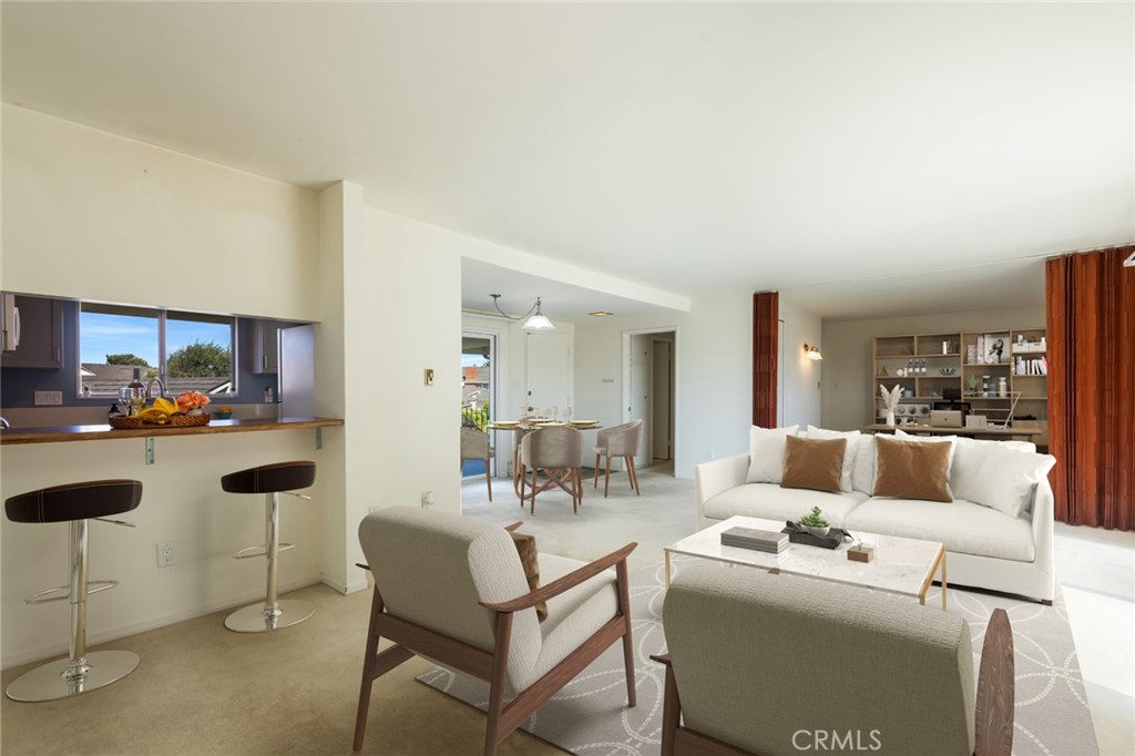 23026 Nadine Circle, Unit B Torrance, CA 90505 - Photo 13 of 56 a living room with furniture and a table