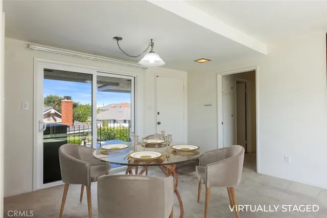 a bathroom with a granite countertop toilet a sink and a mirror