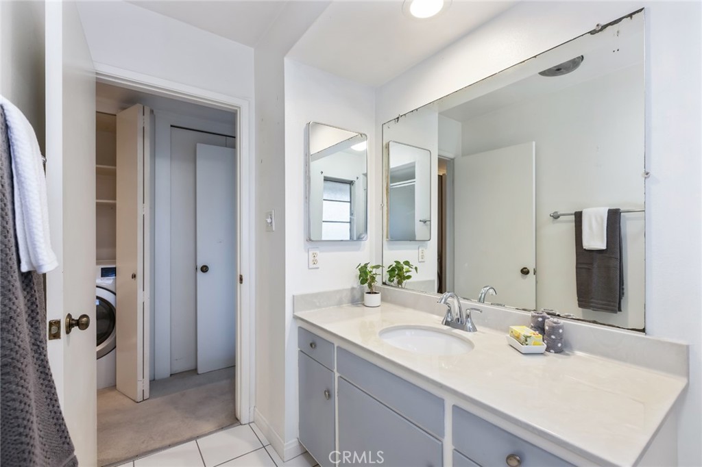 23026 Nadine Circle, Unit B Torrance, CA 90505 - Photo 22 of 56 a bathroom with a sink and a mirror