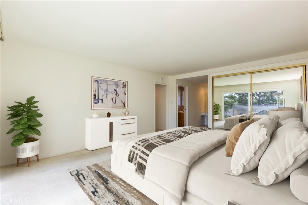 23026 Nadine Circle, Unit B Torrance, CA 90505 - Photo 24 of 56 a bed sitting in a bedroom next to a window with a potted plant