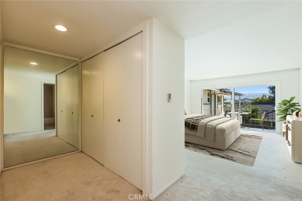 23026 Nadine Circle, Unit B Torrance, CA 90505 - Photo 26 of 56 a bedroom with furniture and a potted plant