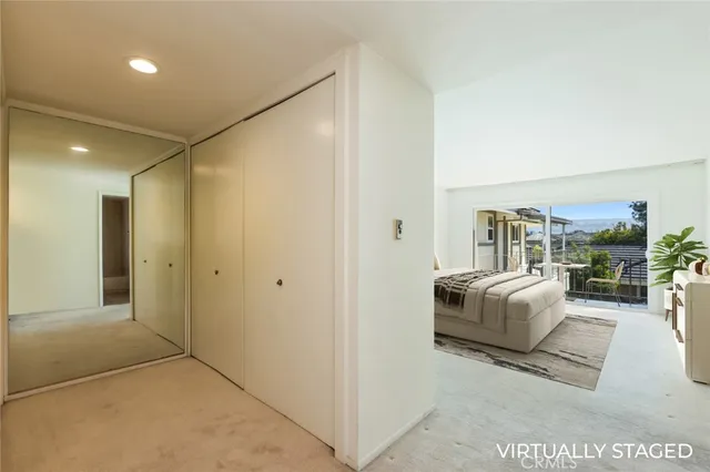 a view of a workspace with furniture and bathroom view