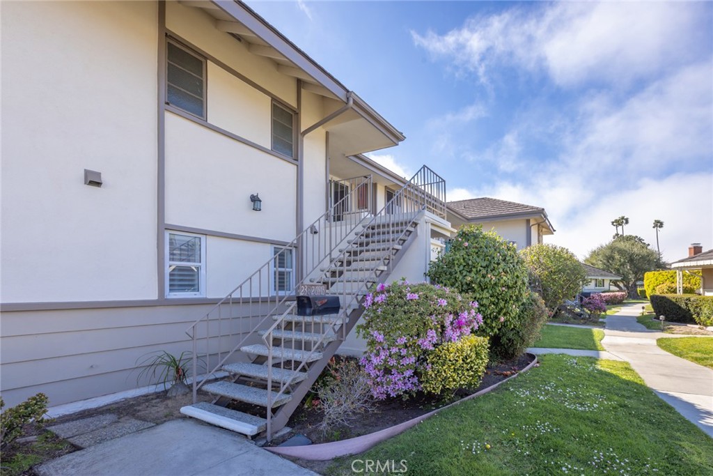 23026 Nadine Circle, Unit B Torrance, CA 90505 - Photo 3 of 56 a front view of a house with garden