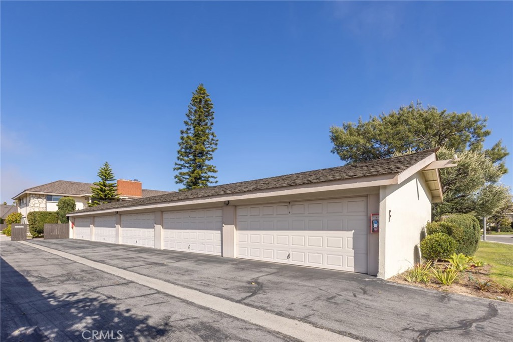 23026 Nadine Circle, Unit B Torrance, CA 90505 - Photo 37 of 56 a view of a house with a yard and garage