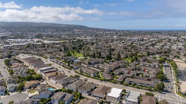 a view of swimming pool in front of residential houses