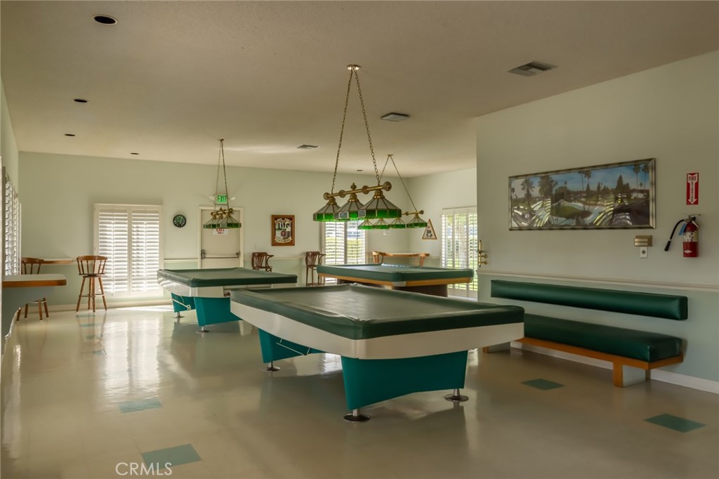 23026 Nadine Circle, Unit B Torrance, CA 90505 - Photo 53 of 56 a room with pool table and a chandelier