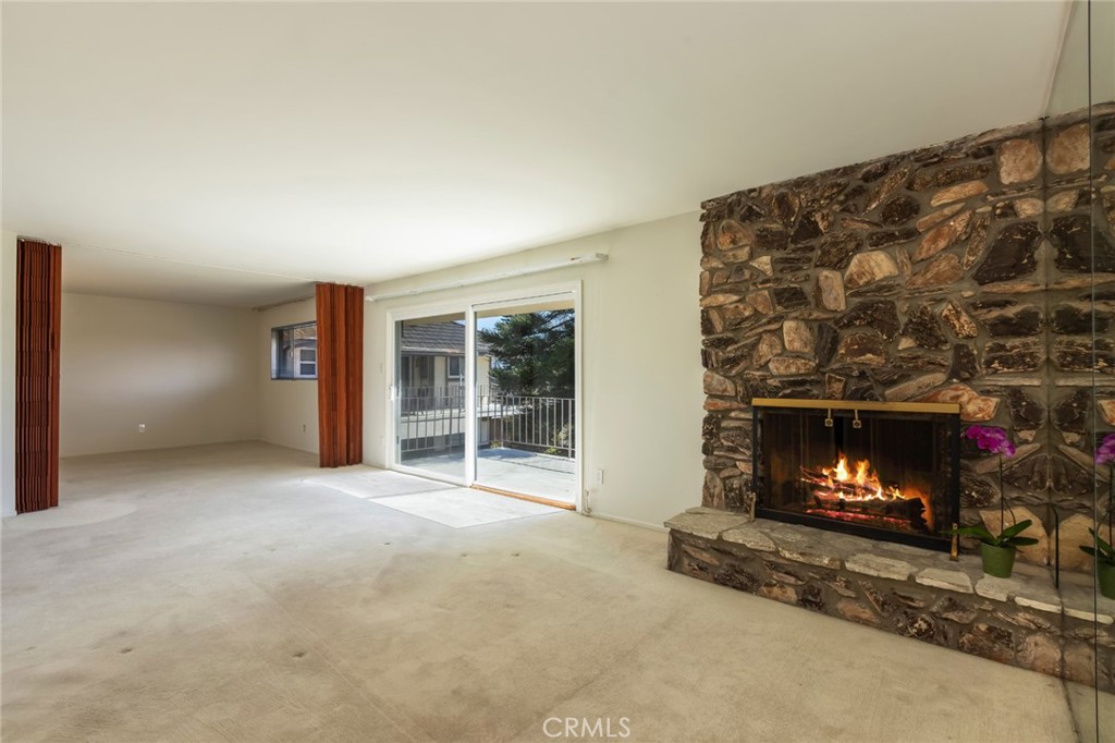 23026 Nadine Circle, Unit B Torrance, CA 90505 - Photo 6 of 56 a view of an empty room with a fireplace