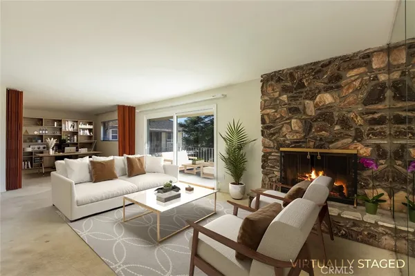 a view of an empty room with a fireplace