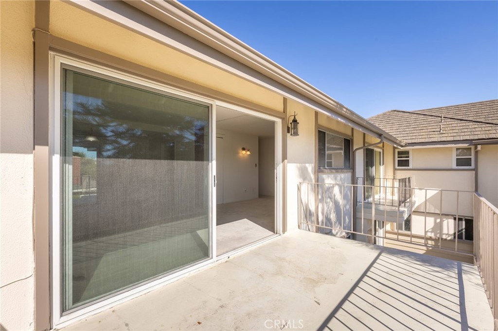 23026 Nadine Circle, Unit B Torrance, CA 90505 - Photo 10 of 56 a balcony view with a glass door