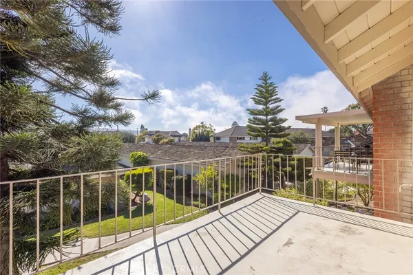 a balcony view with a glass door