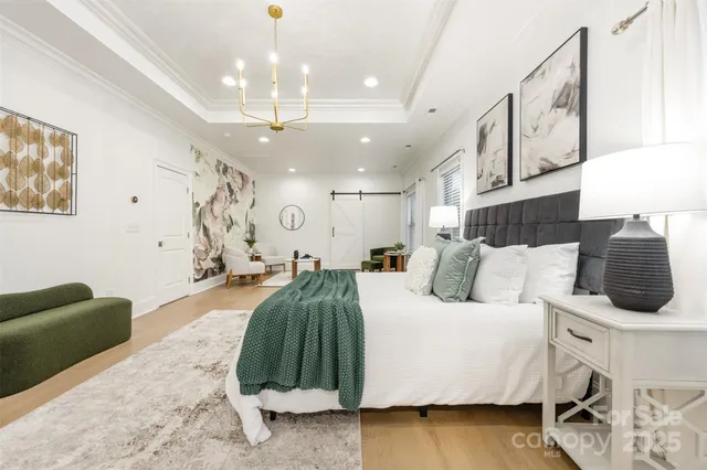 a bedroom with a bed window and couch