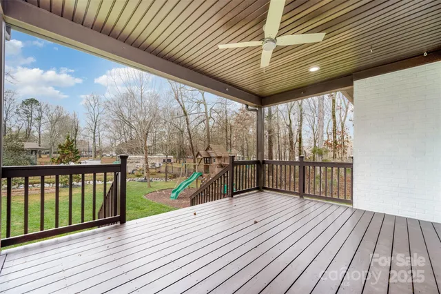 a view of a balcony with wooden floor