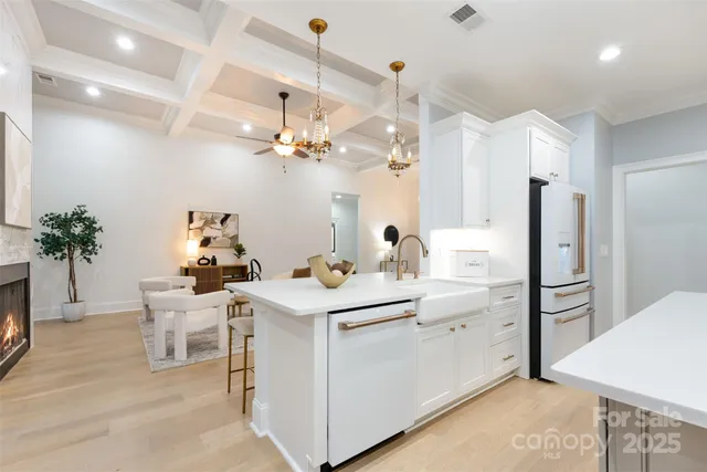 a kitchen with a sink and refrigerator