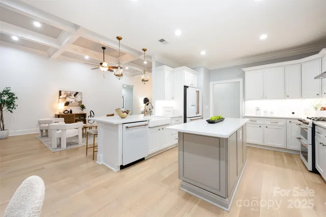a kitchen that has a lot of cabinets in it and appliances