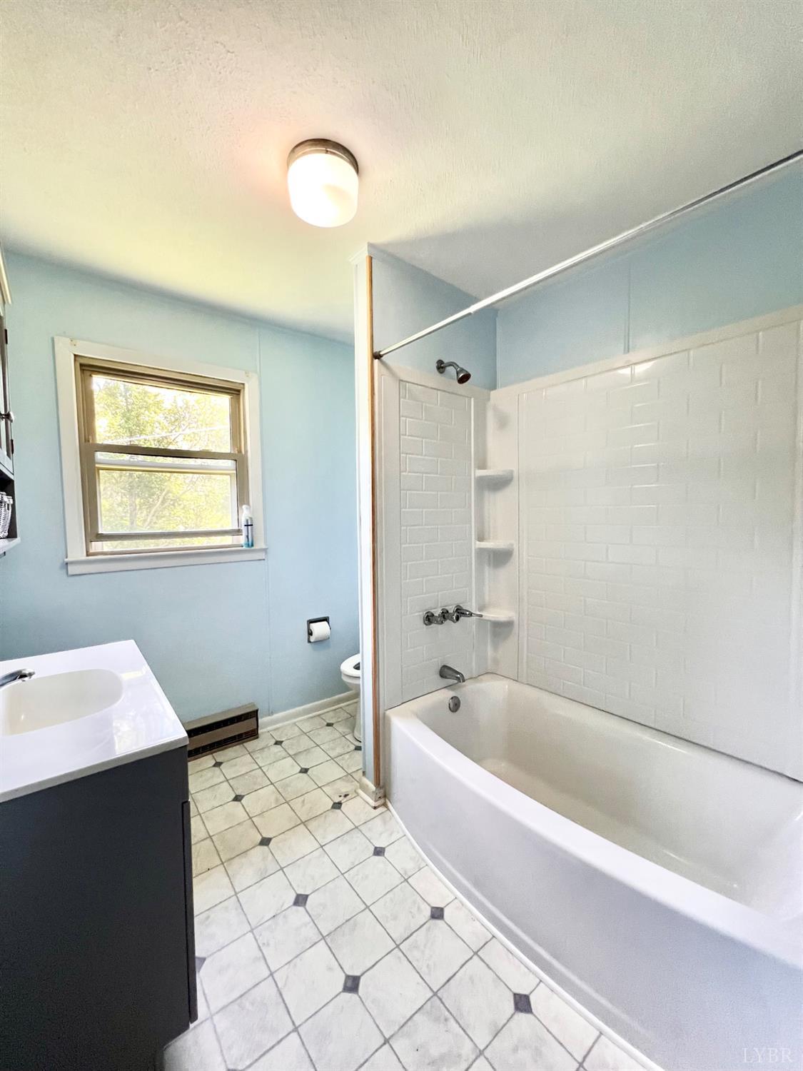 2785 Pera Road Monroe, VA 24574 - Photo 23 of 45 a spacious bathroom with a bathtub sink and mirror