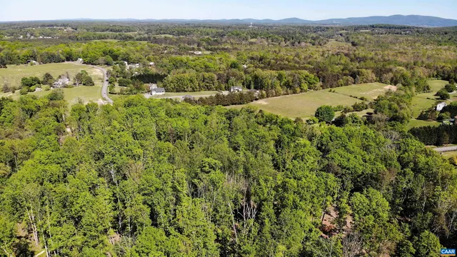 an aerial view of mountain with trees