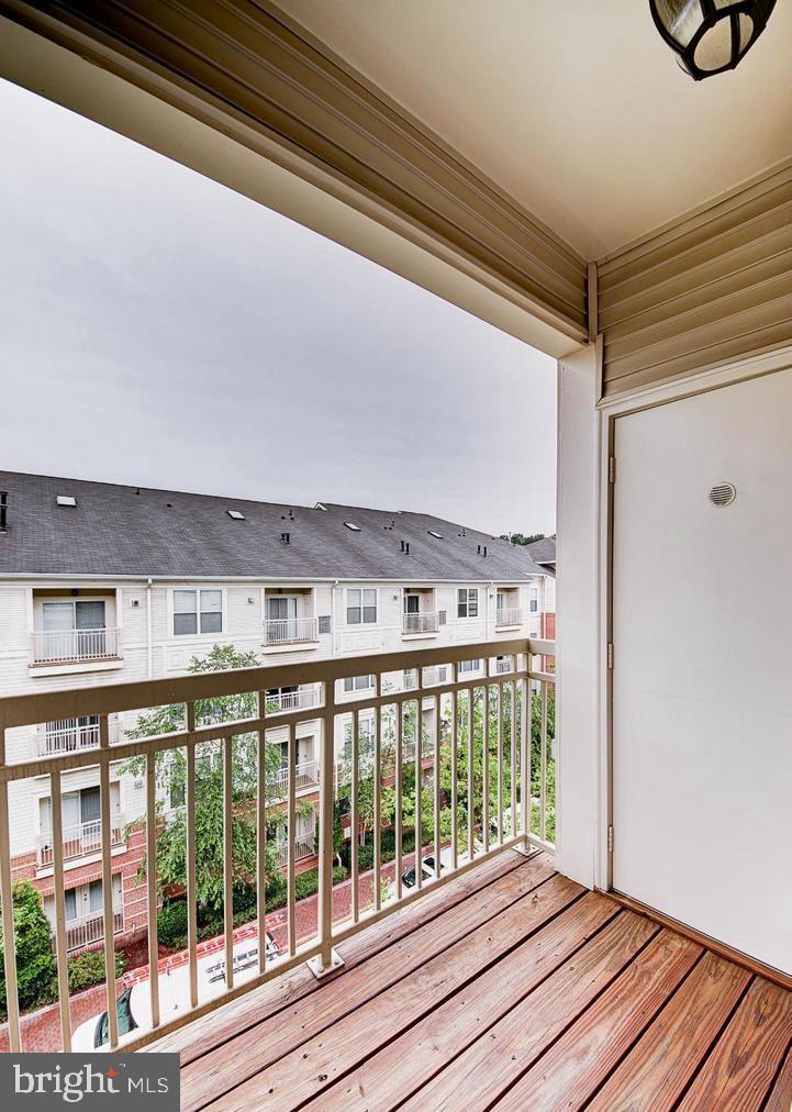 9480 Virginia Center Boulevard, Unit 420 Vienna, VA 22181 - Photo 11 of 17 a view of a balcony with wooden floor
