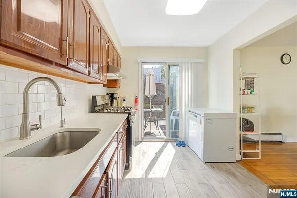 a kitchen with a sink and a refrigerator
