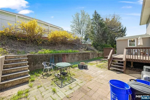 a view of a chairs and table in the patio