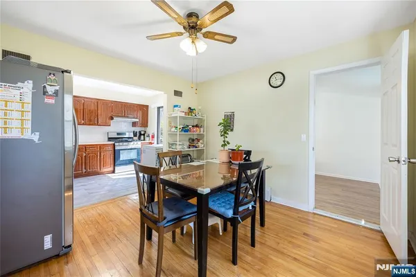 a view of a dining room with furniture and wooden floor