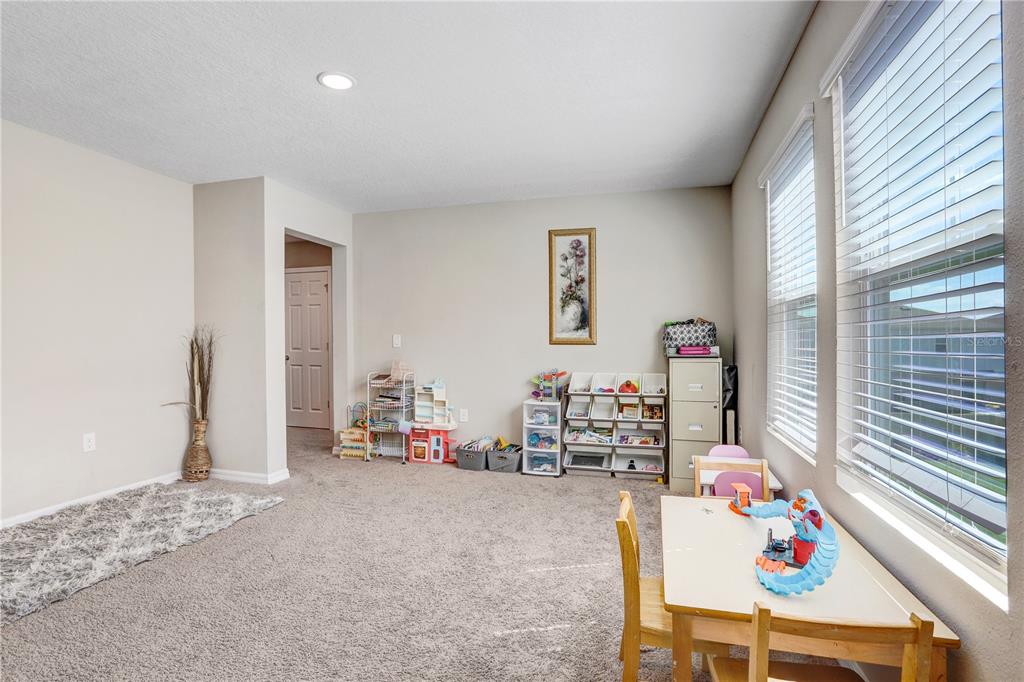 7704 Twinleaf Ter Way Parrish, FL 34219 - Photo 20 of 31 a living room with furniture and a window