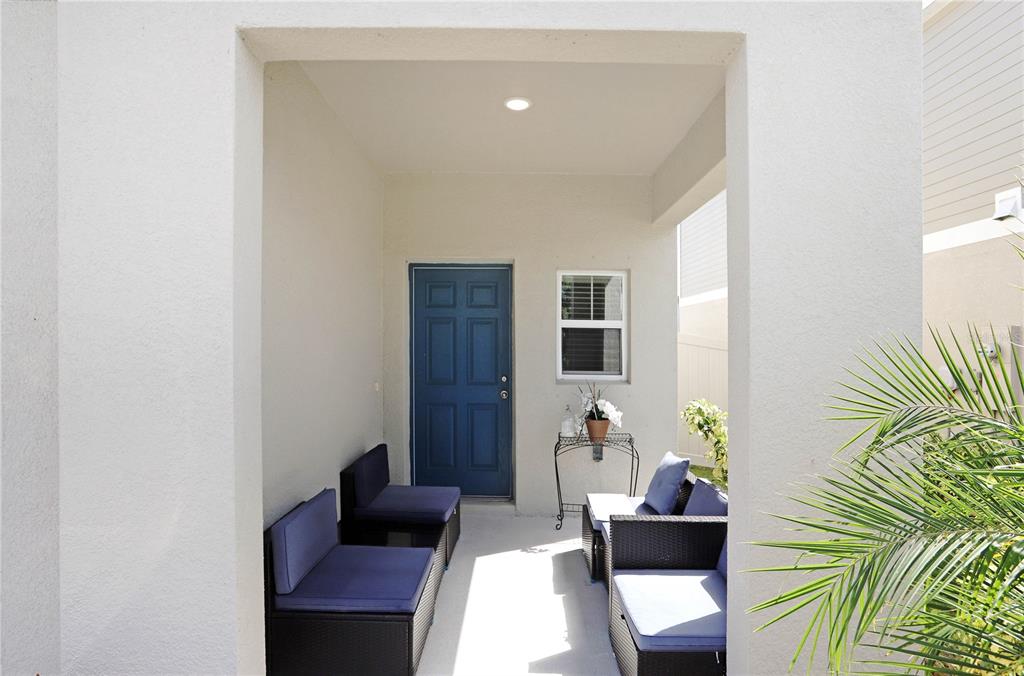 7704 Twinleaf Ter Way Parrish, FL 34219 - Photo 3 of 31 a living room with furniture and a potted plant