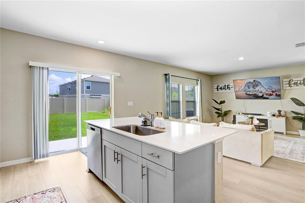 7704 Twinleaf Ter Way Parrish, FL 34219 - Photo 8 of 31 a kitchen with a sink and cabinets