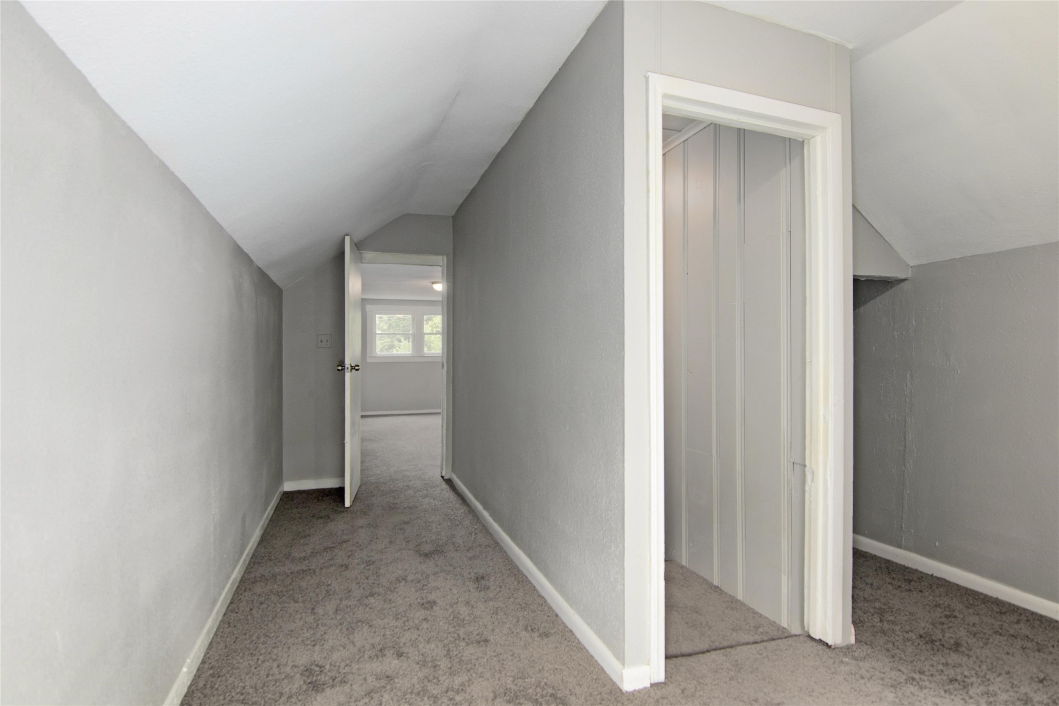 3220 Melbourne Street Houston, TX 77026 - Photo 17 of 23 a view of a hallway with wooden floor and a window