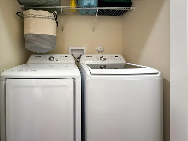 a utility room with dryer and washer
