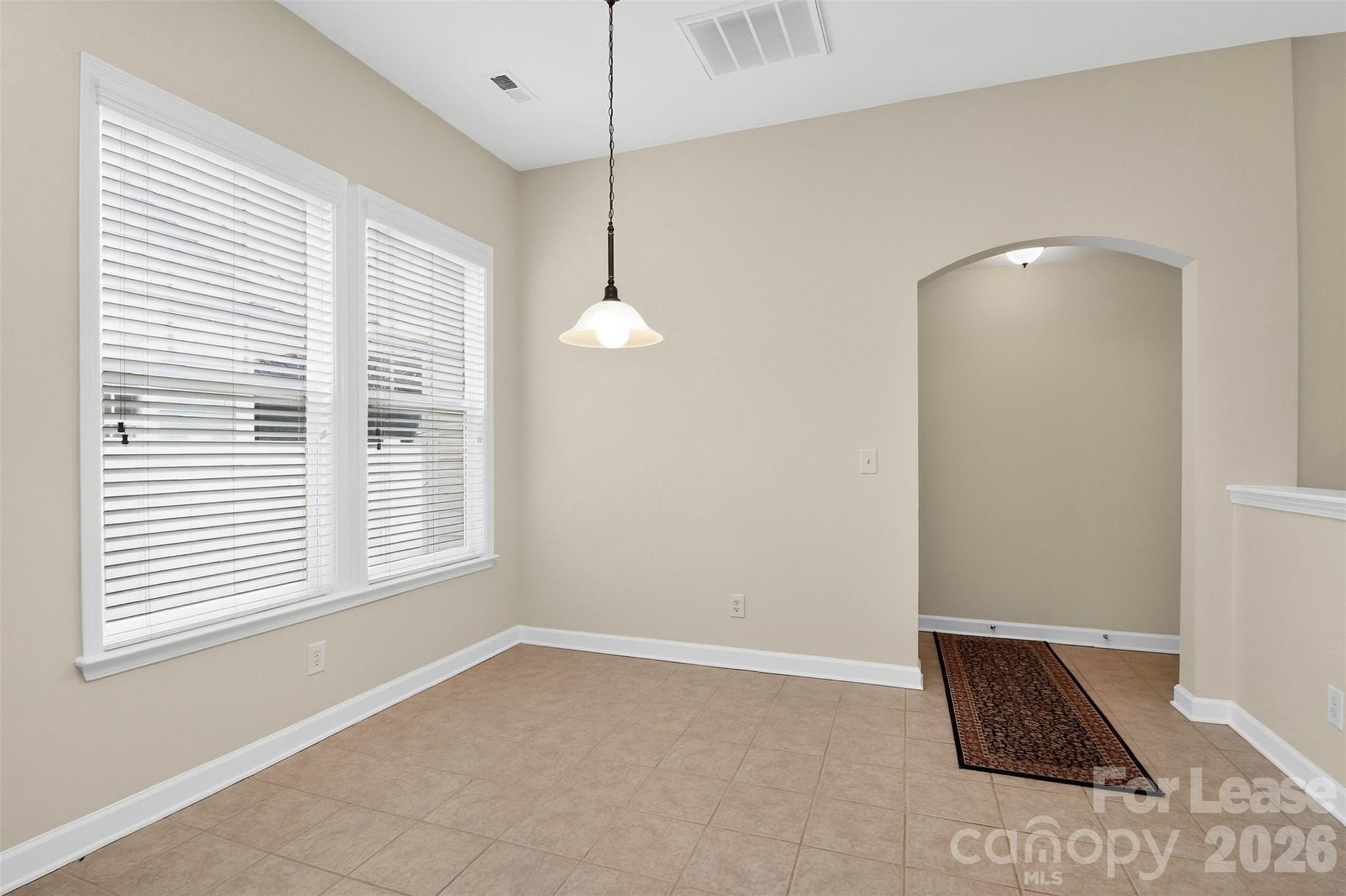 9315 Rosalyn Glen Road Cornelius, NC 28031 - Photo 15 of 35 a view of an empty room with a window