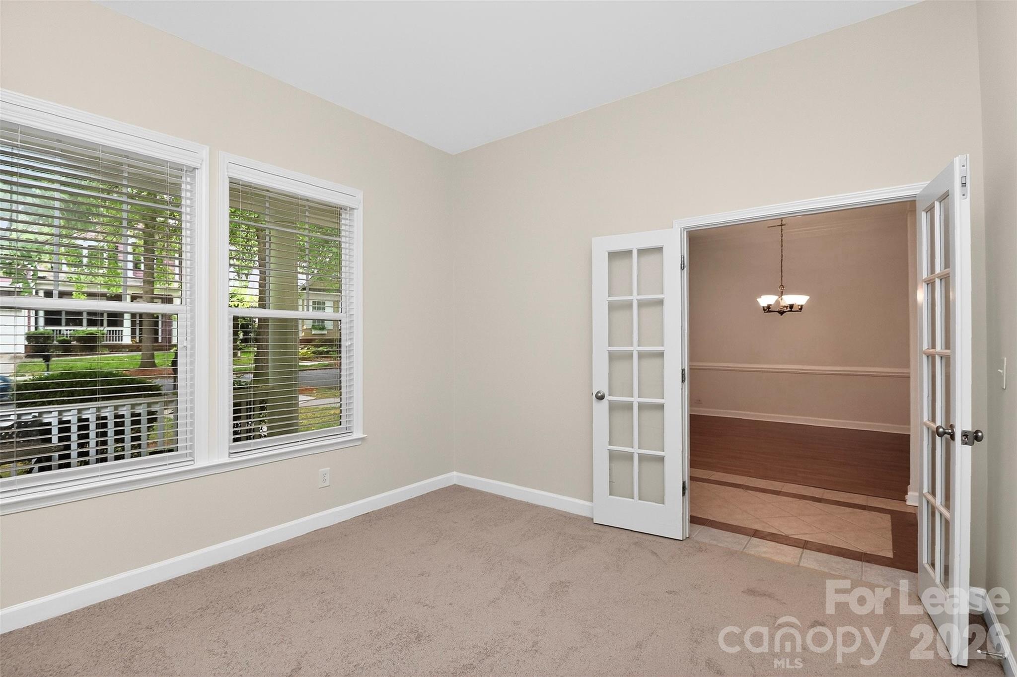 9315 Rosalyn Glen Road Cornelius, NC 28031 - Photo 2 of 35 a view of an empty room with a window