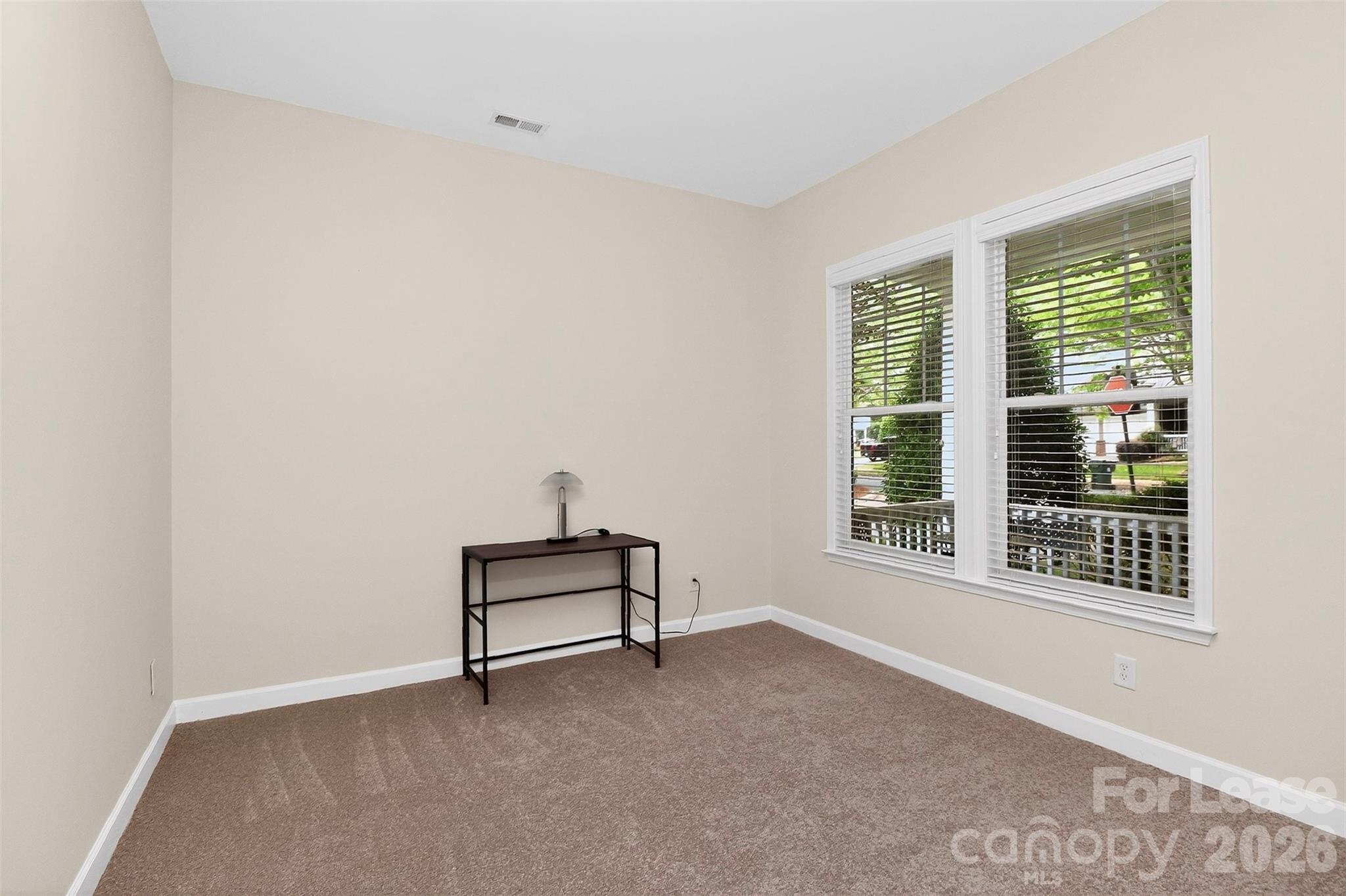 9315 Rosalyn Glen Road Cornelius, NC 28031 - Photo 3 of 35 a view of wooden floor and windows in a room