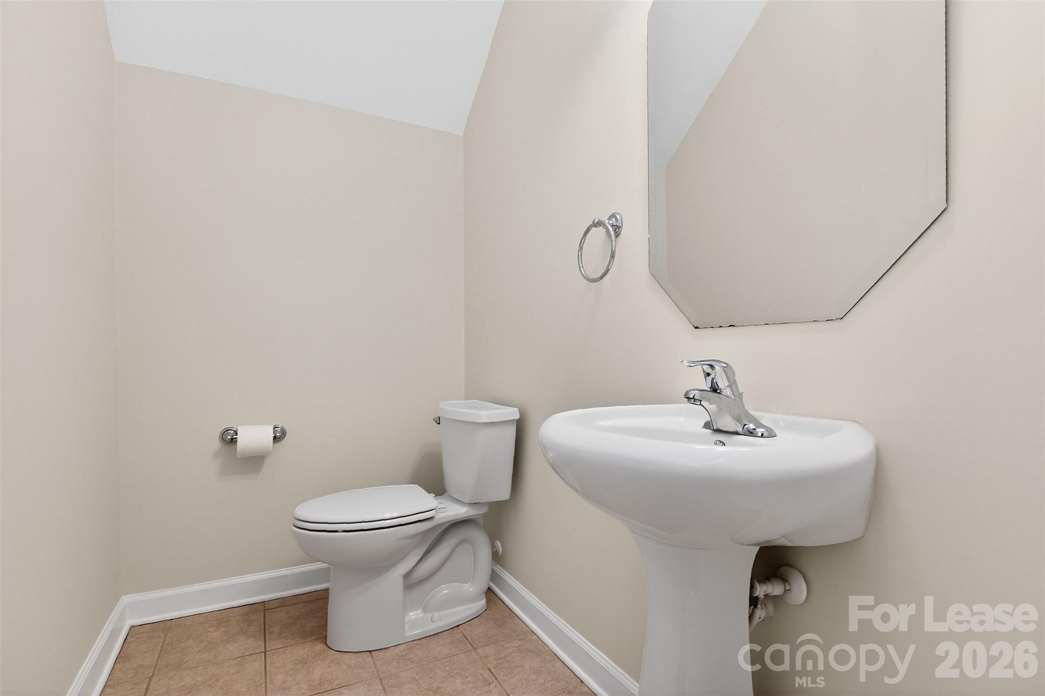9315 Rosalyn Glen Road Cornelius, NC 28031 - Photo 31 of 35 a bathroom with a sink toilet and a mirror
