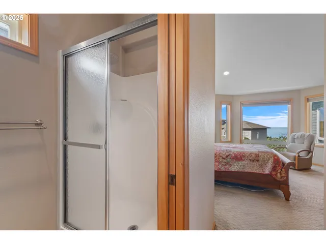 a bathroom with a sink double vanity granite and a mirror