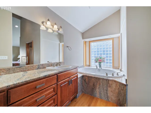 a bath tub sitting in a bathroom next to a window