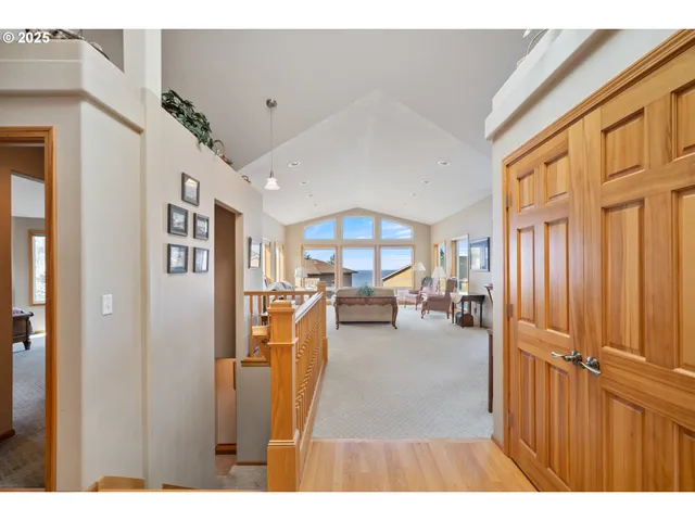 a living room with furniture and a book shelf