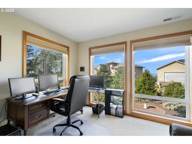 a kitchen with a refrigerator and cabinets