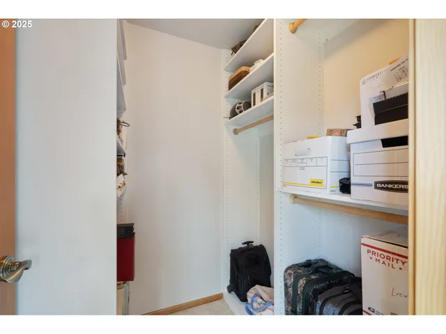a bathroom with a granite countertop toilet sink and mirror