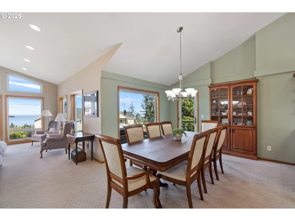 a view of a dining room with furniture and window